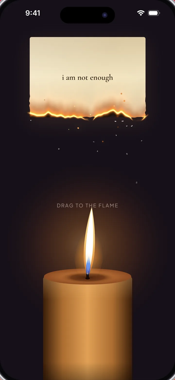 A paper reading “i am not enough” burning above a candle